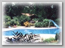 Pool with waterslide in the garden at Malpais Surf Camp